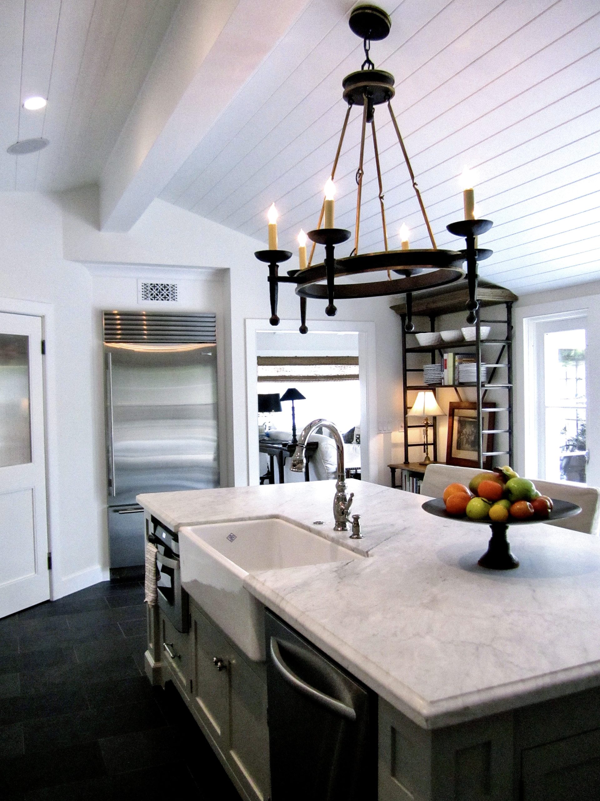 Renovated white kitchen with island painted in Benjamin Moore Fieldstone