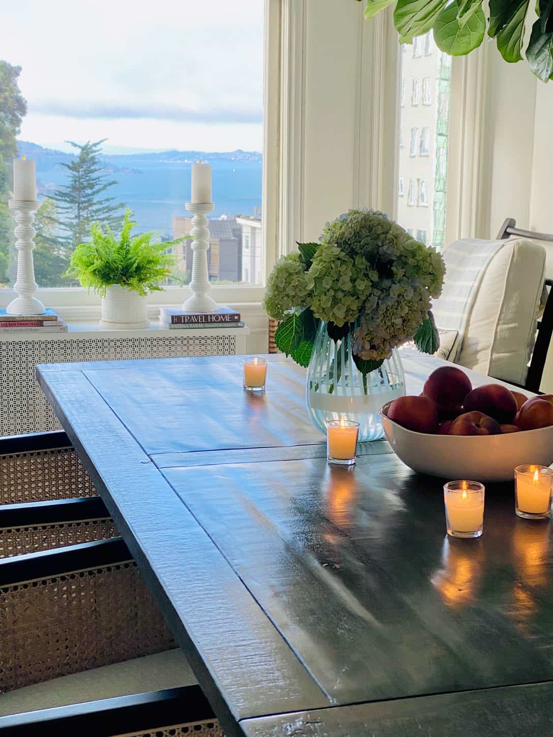 votive candles from dining room with view of San Francisco