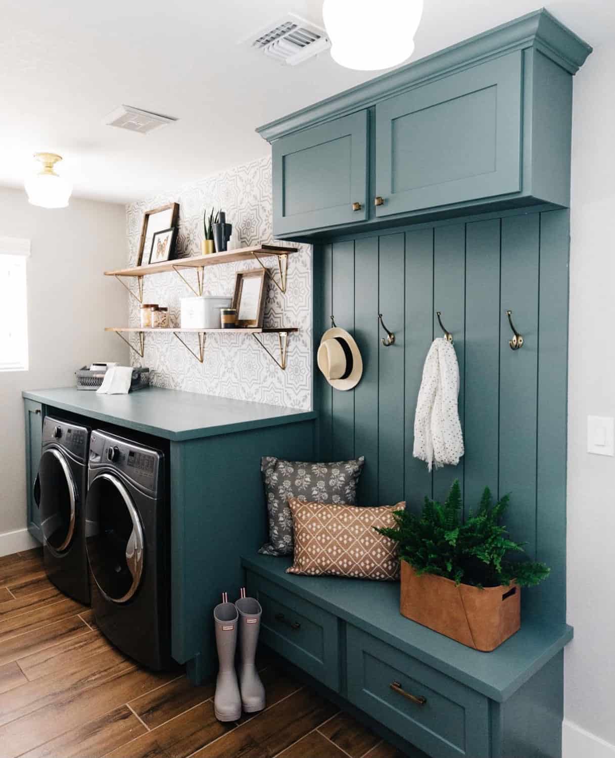 Teal laundry room with clothing hooks