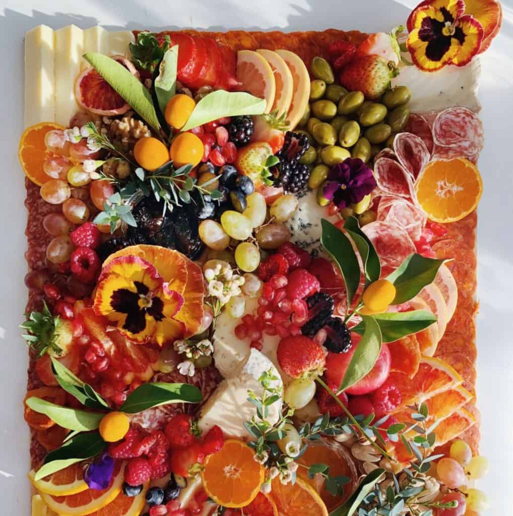 Fruit and Cheese board with edible flowers