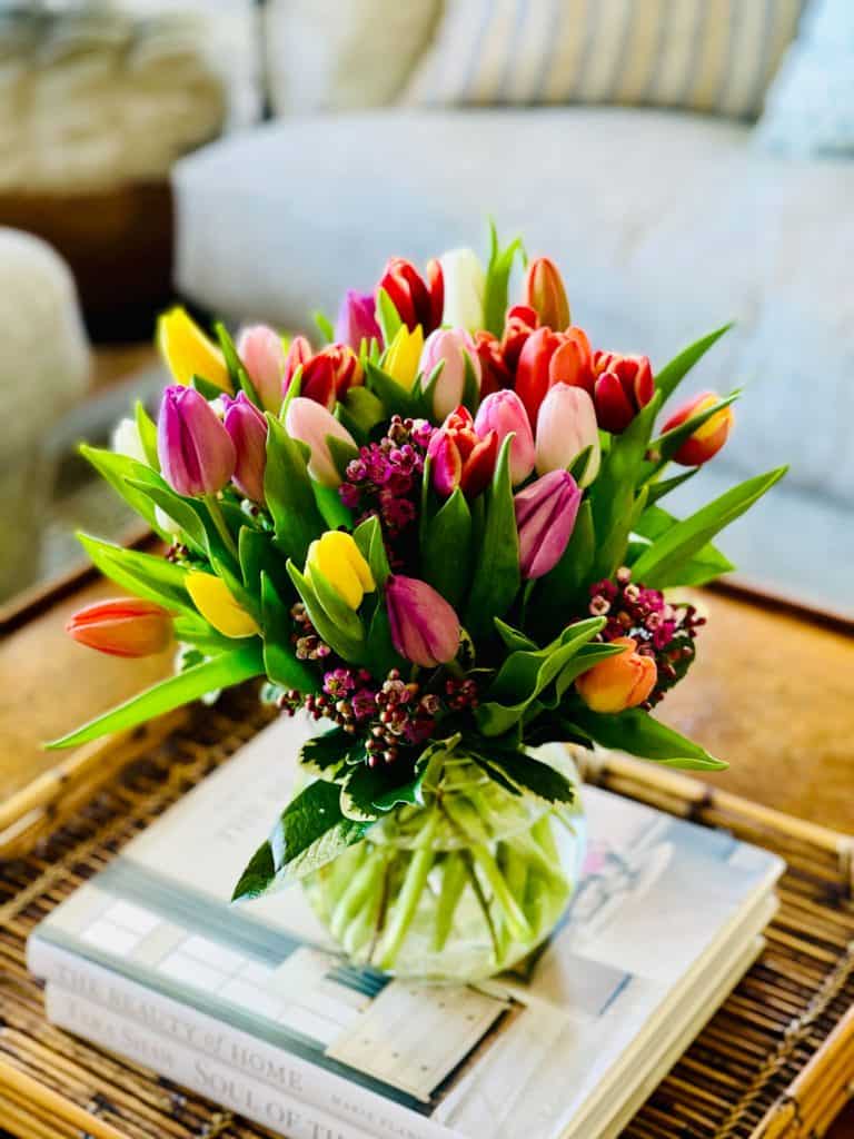 multi-colored tulips on coffee table