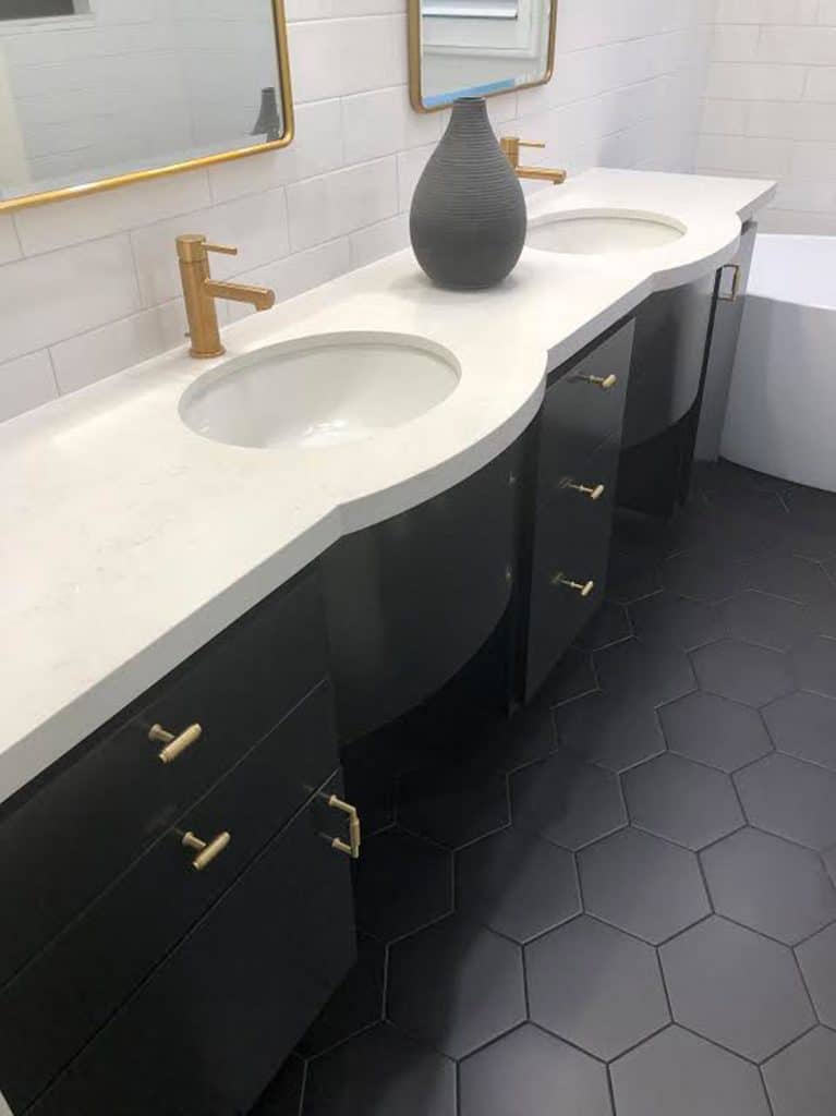 black and white bathroom with hexagon tile floor