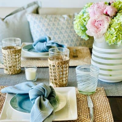 light blue and rattan table setting