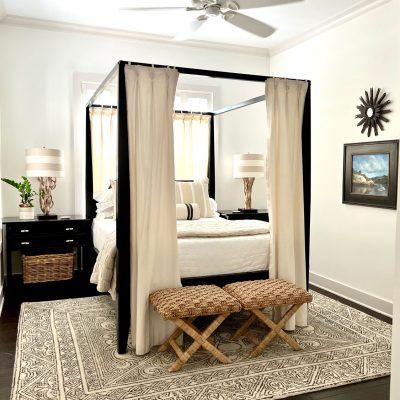 neutral bedroom with four poster bed