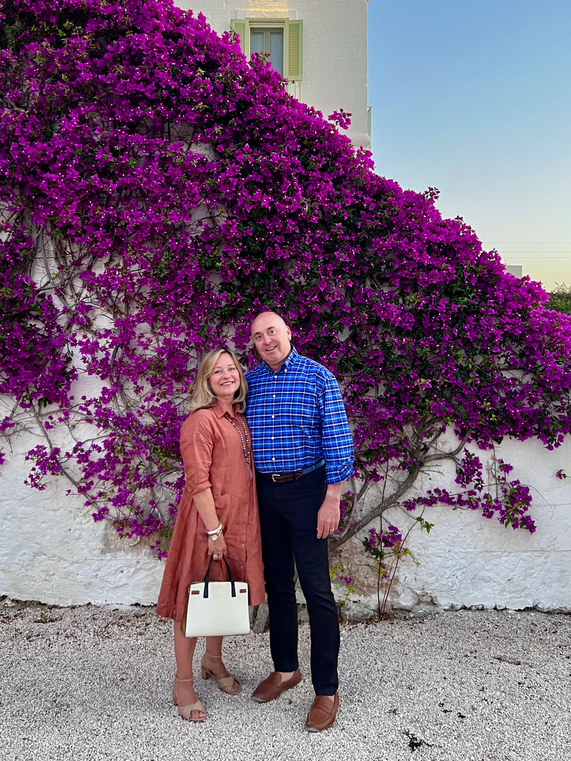 Mary Ann and Howard in front of Bougainvillea in Puglia