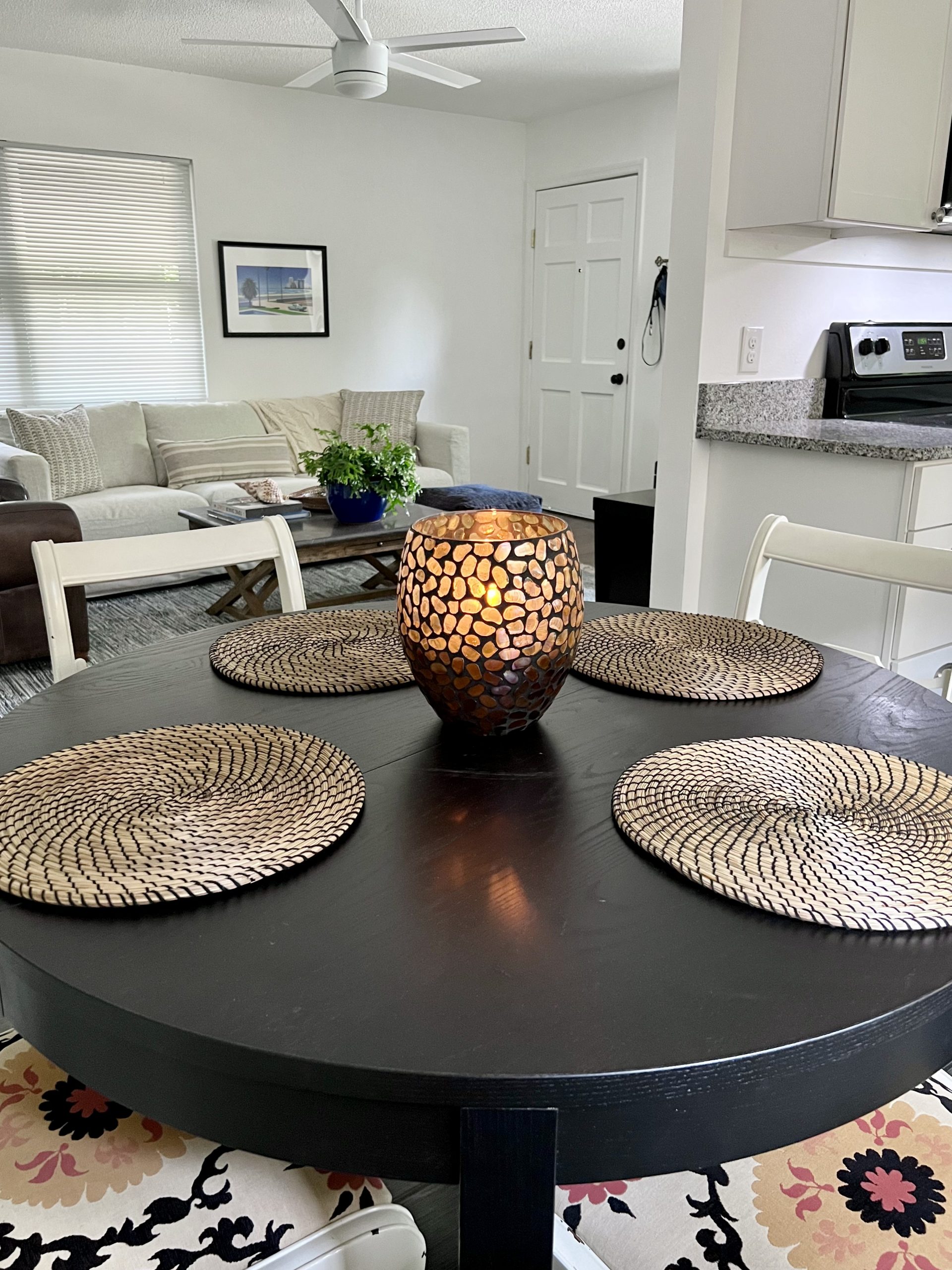 round black table with wicker placemats