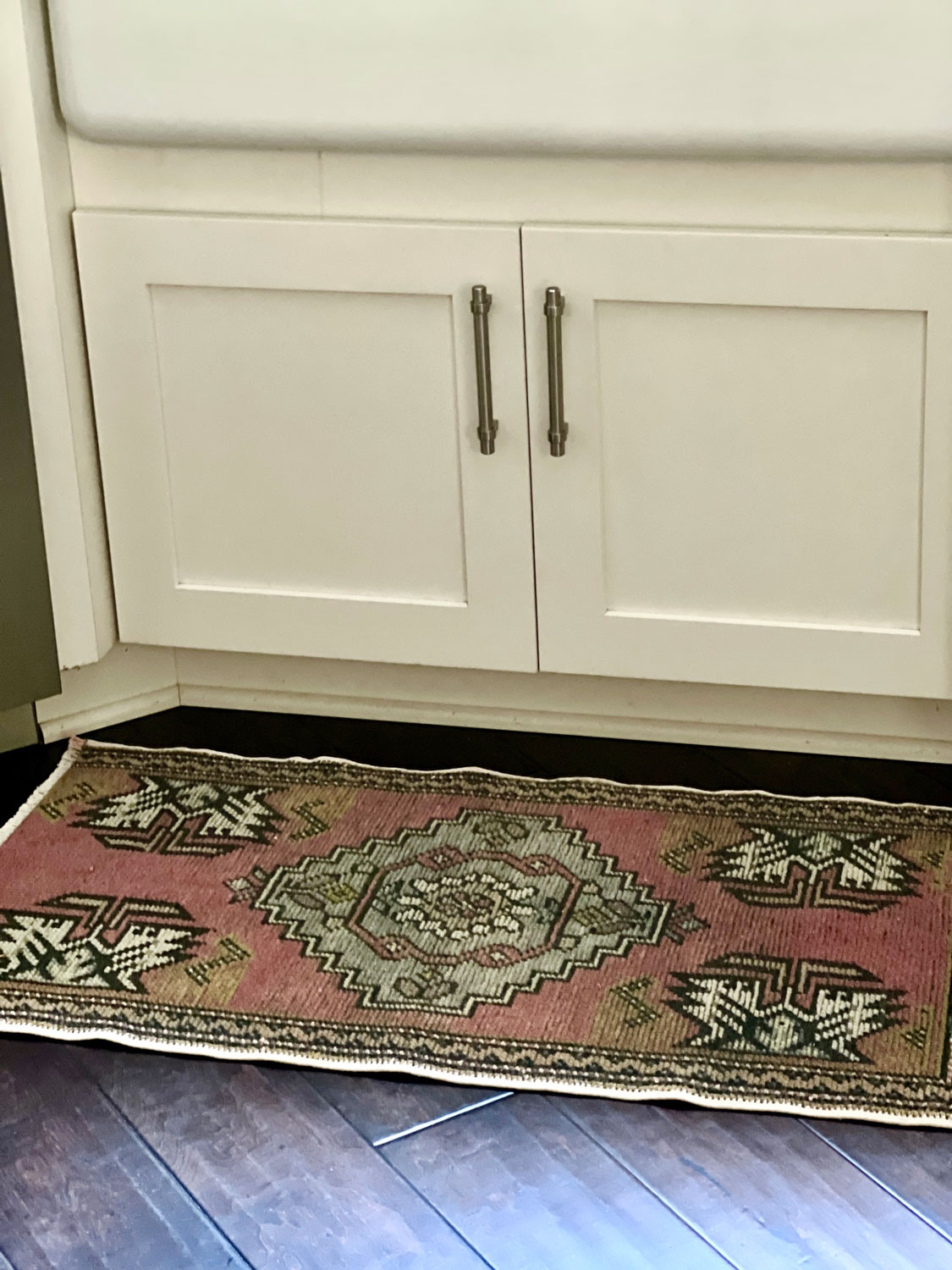 vintage rug by sink