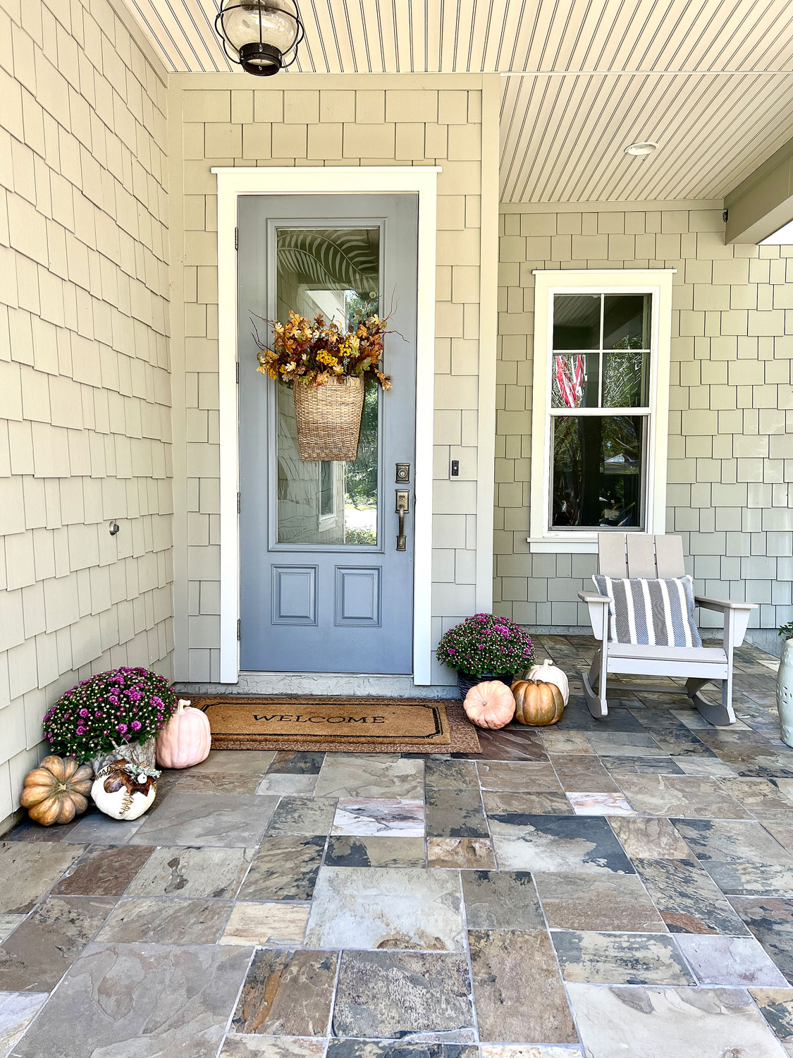 Blue door front porch with rocking chair
