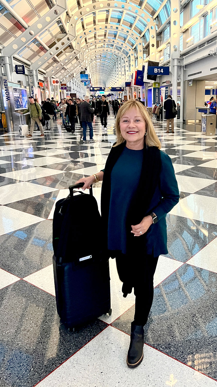Mary Ann Pickett in airport in J.Jill Sweater