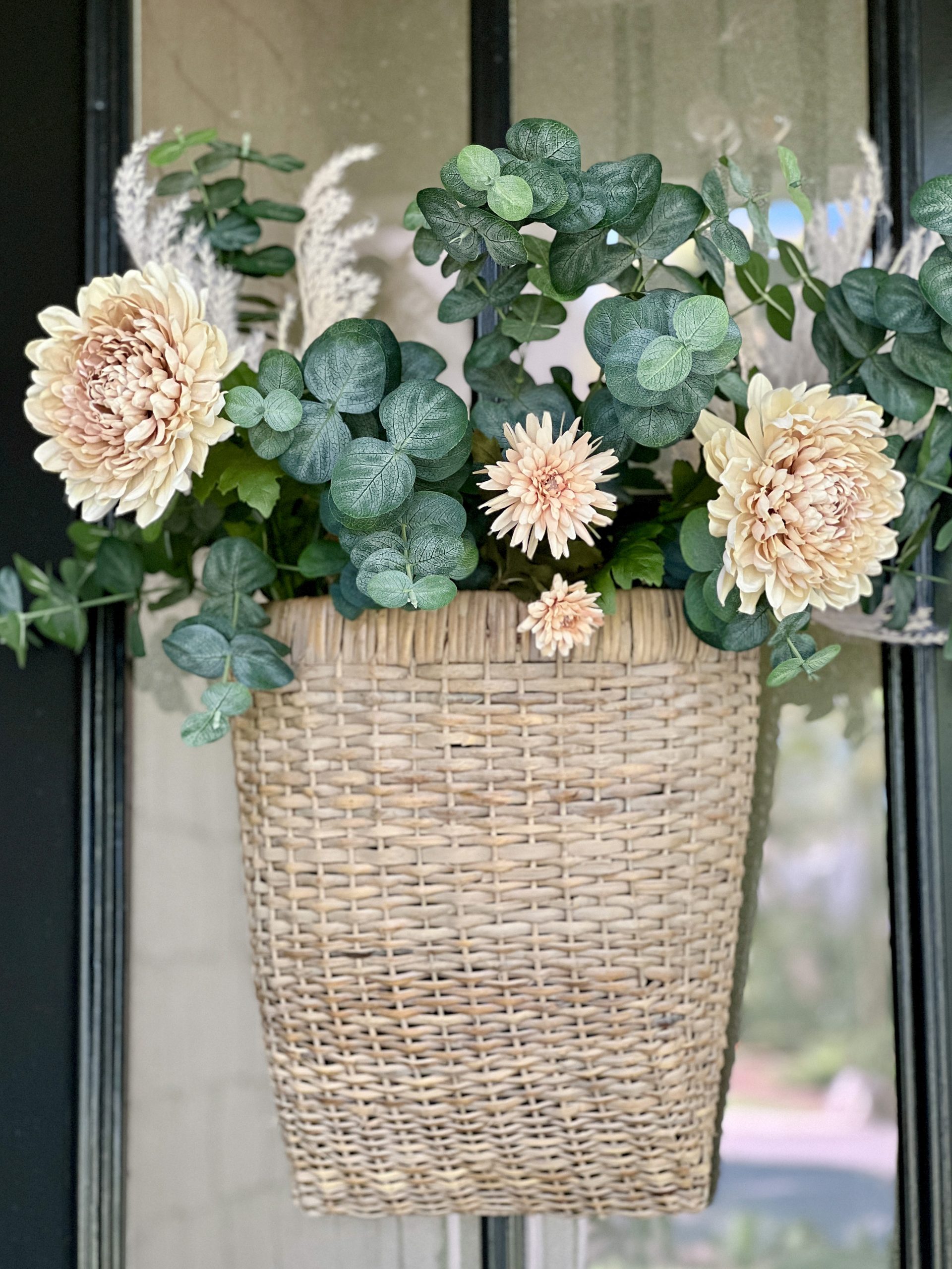large floral basket on front door