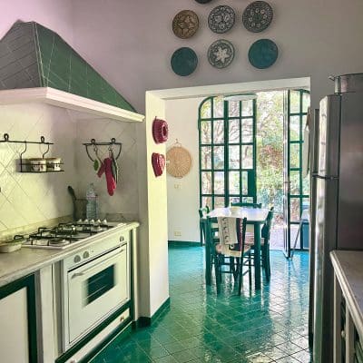 kitchen with green tiled floor