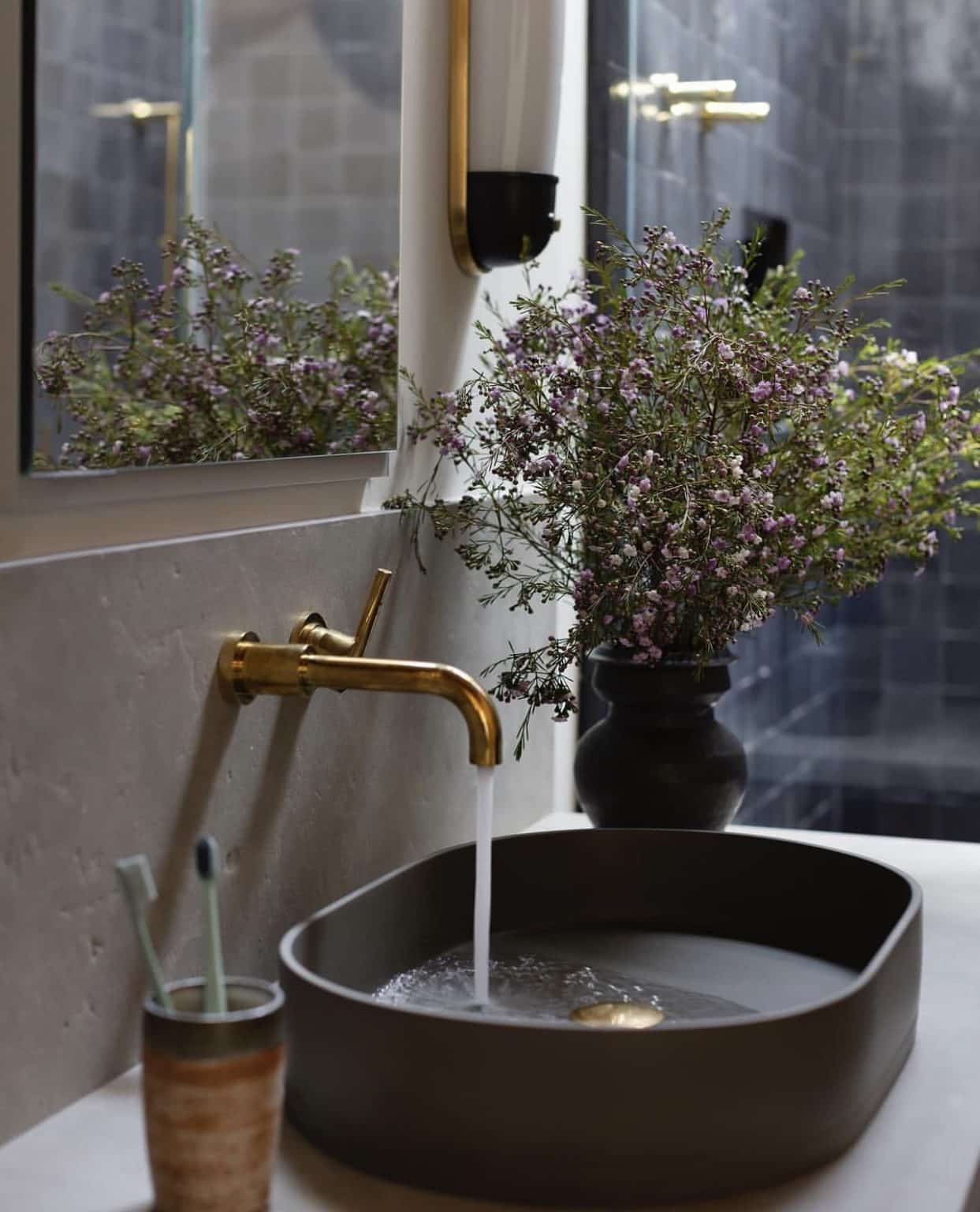 black sink and tall backsplash